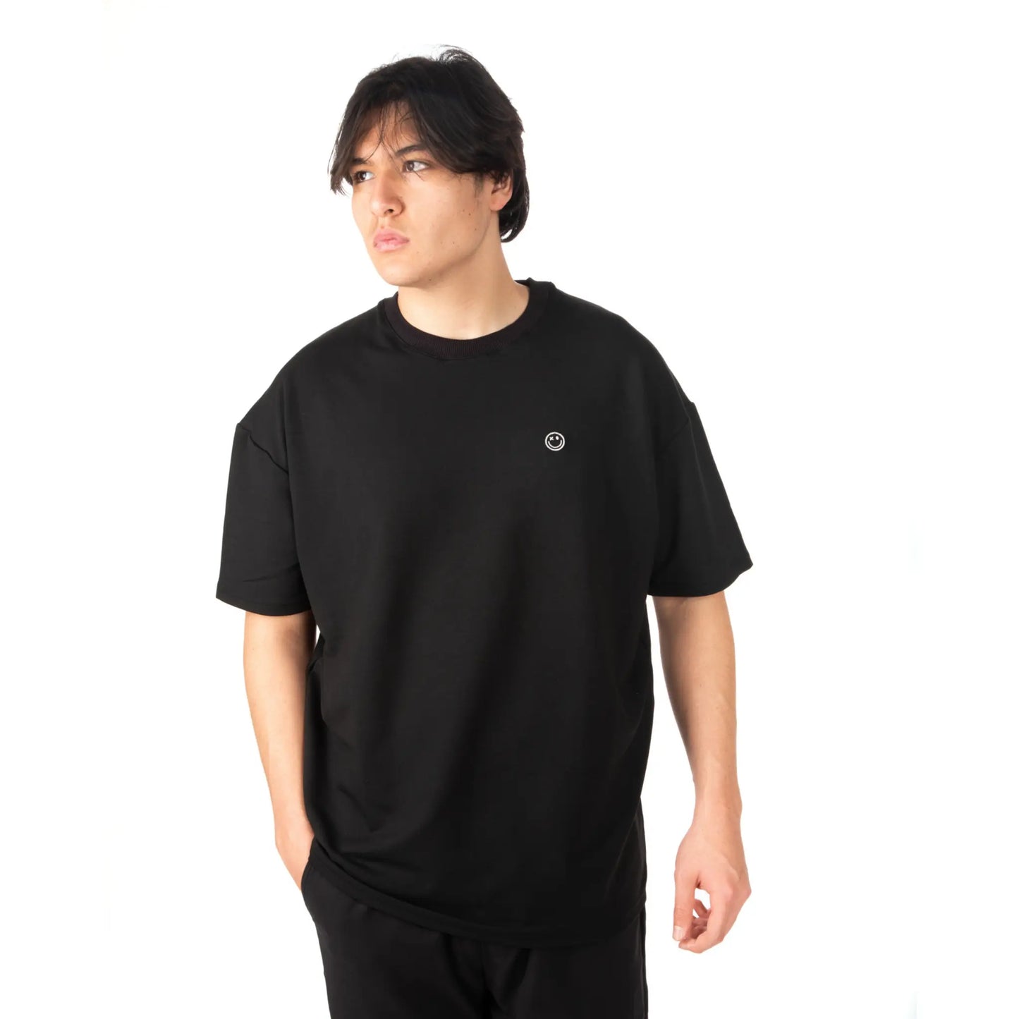 Unisex Oversized Black T-shirt Nous Sommes Catastrophiques zoomed view on male model