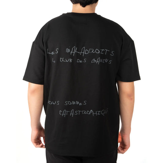 Unisex Oversized Black T-shirt Nous Sommes Catastrophiques Back View on Male Model