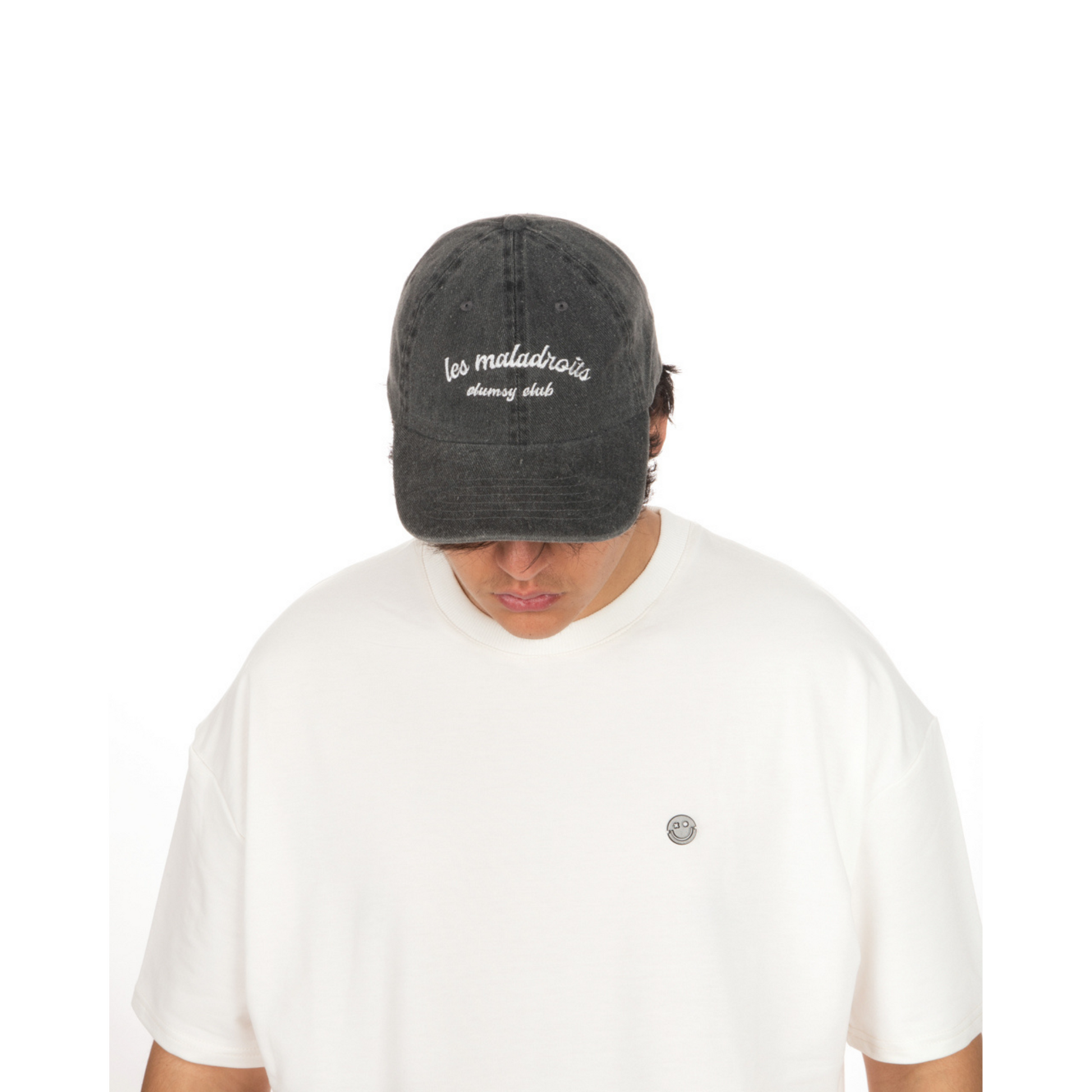 Washed Grey Hat – Les Maladroits Clumsy Club front view on male model with white T-shirt