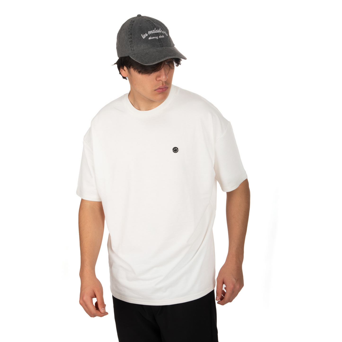 Washed Grey Hat – Les Maladroits Clumsy Club front view on male model with white t-shirt