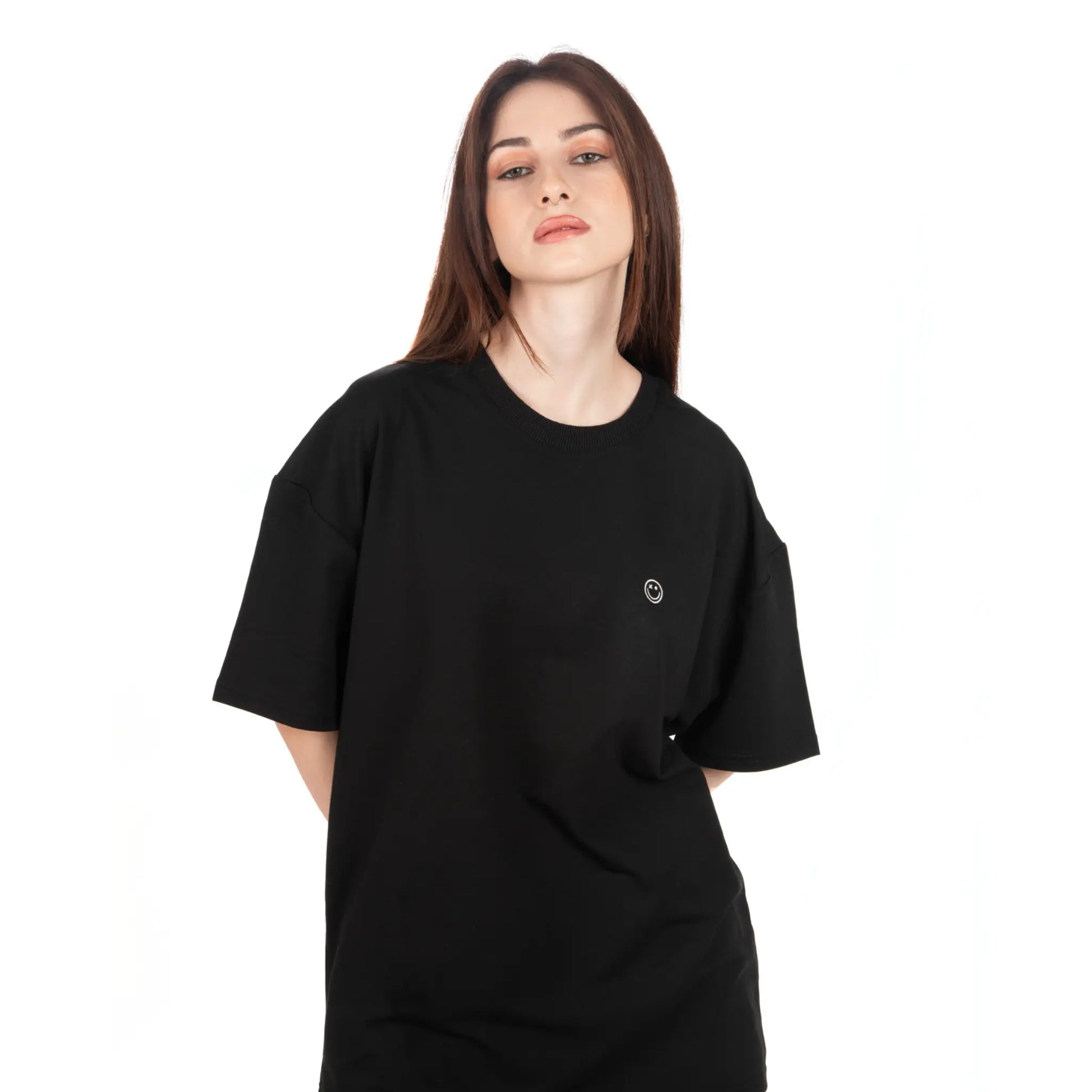 Unisex Oversized Black T-shirt Nous Sommes Catastrophiques zoomed view on female model