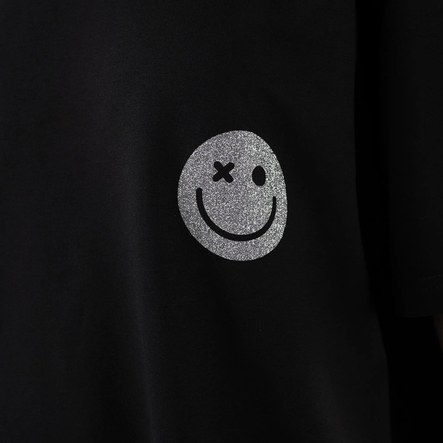 Glitter Smiley Oversized T-shirt Black close up view on logo