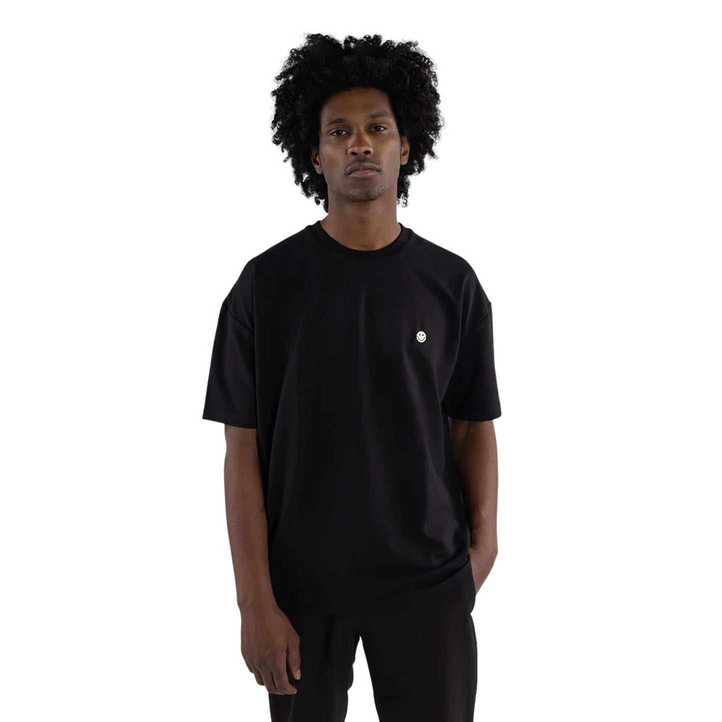 Oversized T-shirt Black worn by black man front close up view