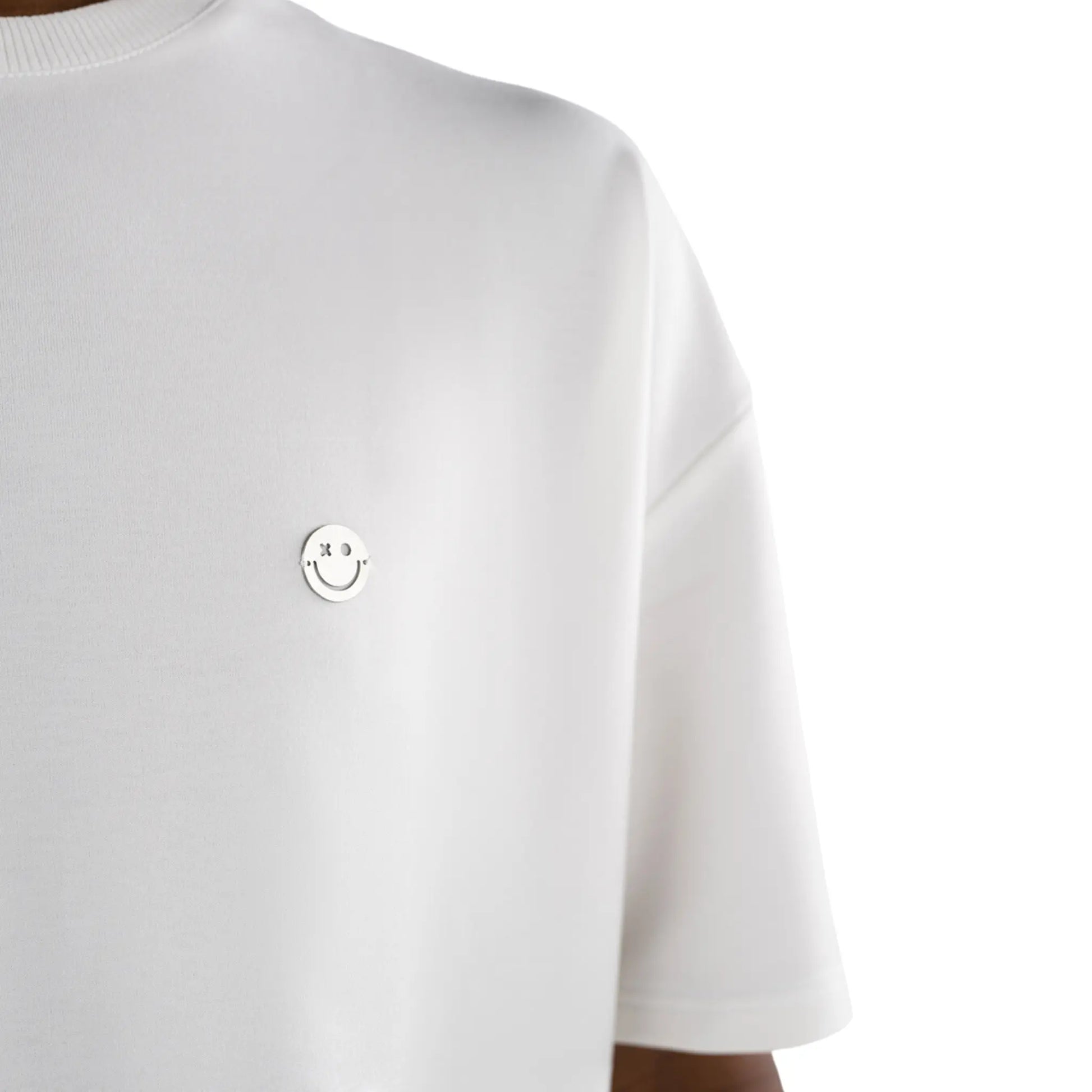Oversized T-shirt White close up view on smiley logo