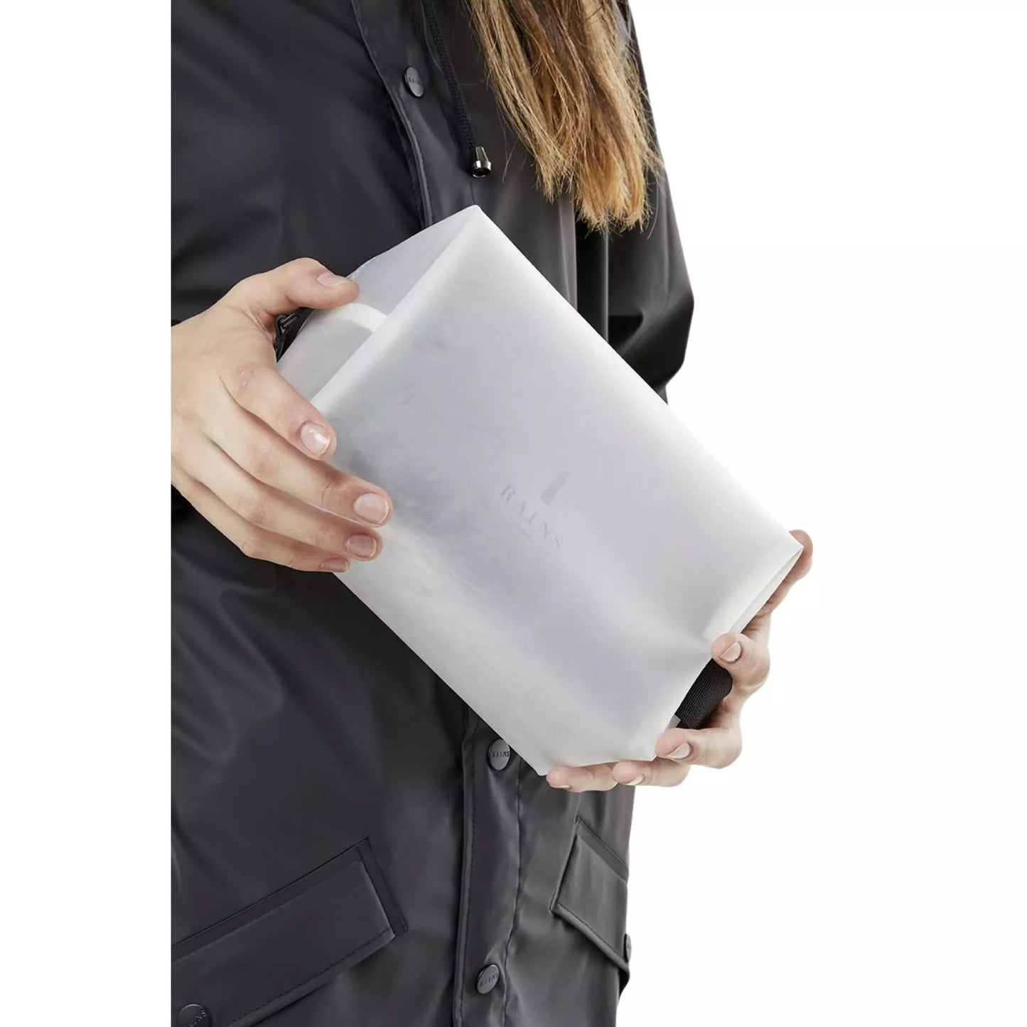 Rains waterproof wash bag foggy white held by a woman